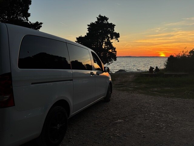Mercedes Vito by the sea at sunset